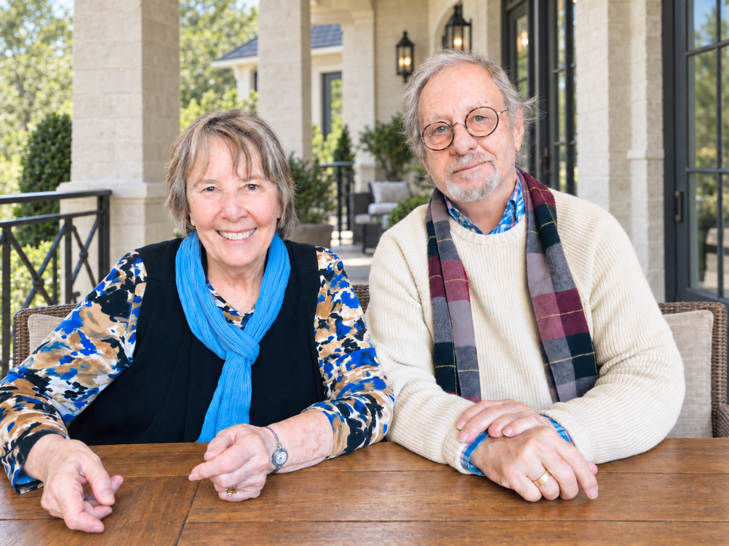 Jerry Lee Johnson and his wife, Linda Ann Johnson, seated together at a table on a veranda